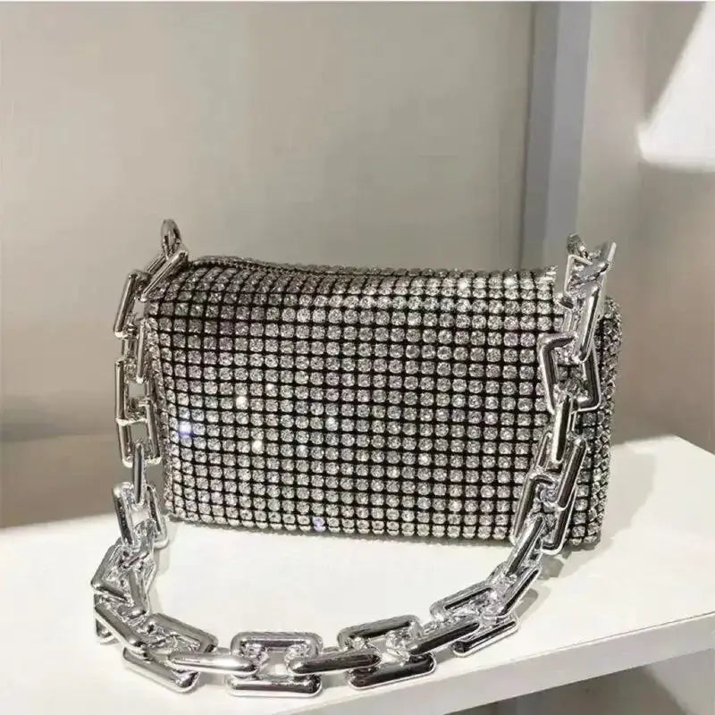 Allover rhinestone bucket bag with glitter chain strap, perfect for prom or versatile occasions.