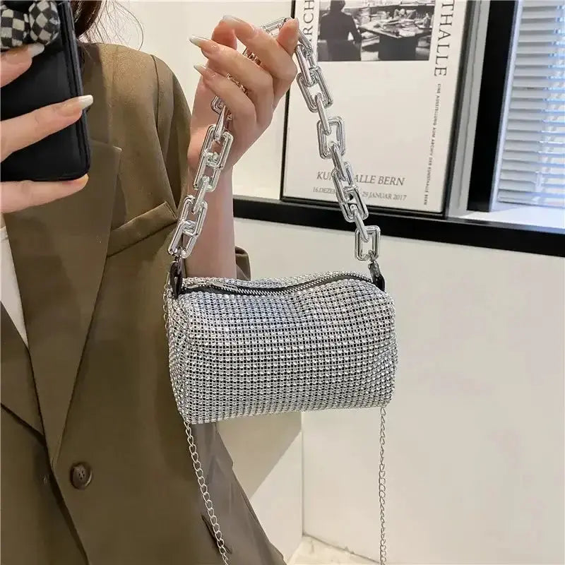 Allover rhinestone bucket bag with glitter chain, perfect for prom and versatile wear for women.