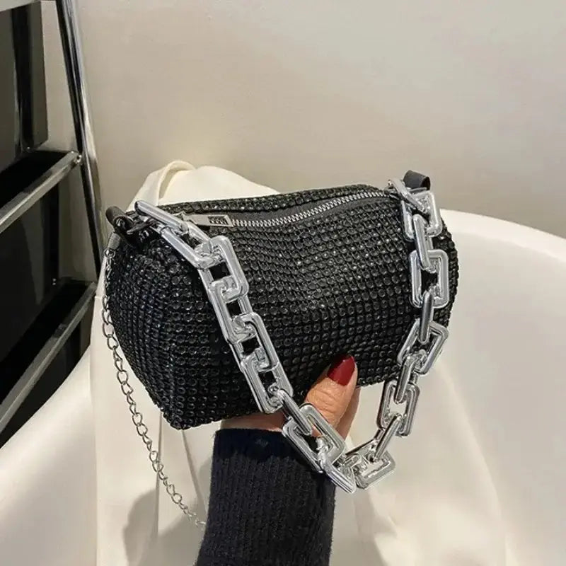 Allover rhinestone black bucket bag with a glitter chain, perfect for women&