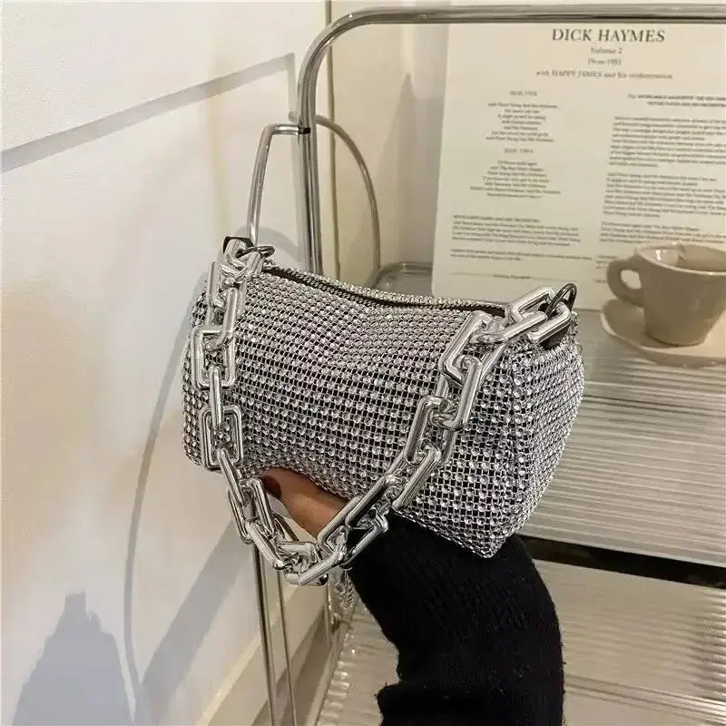 Silver rhinestone bucket bag with chain strap, stylish mini crossbody purse for women.