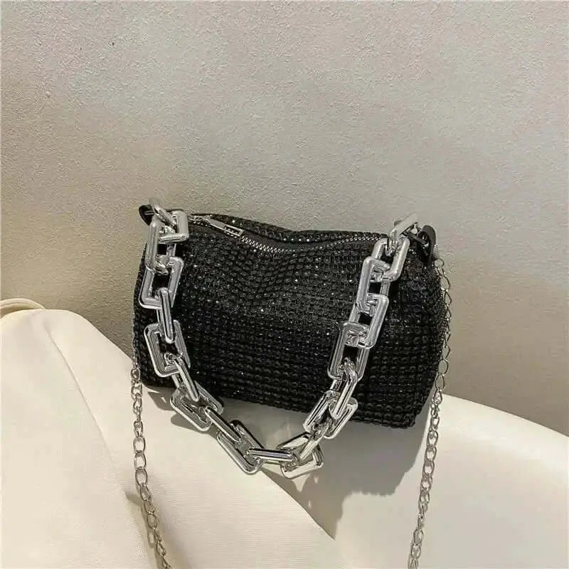 Stylish allover rhinestone bucket bag with a glitter chain, ideal for parties and special occasions.