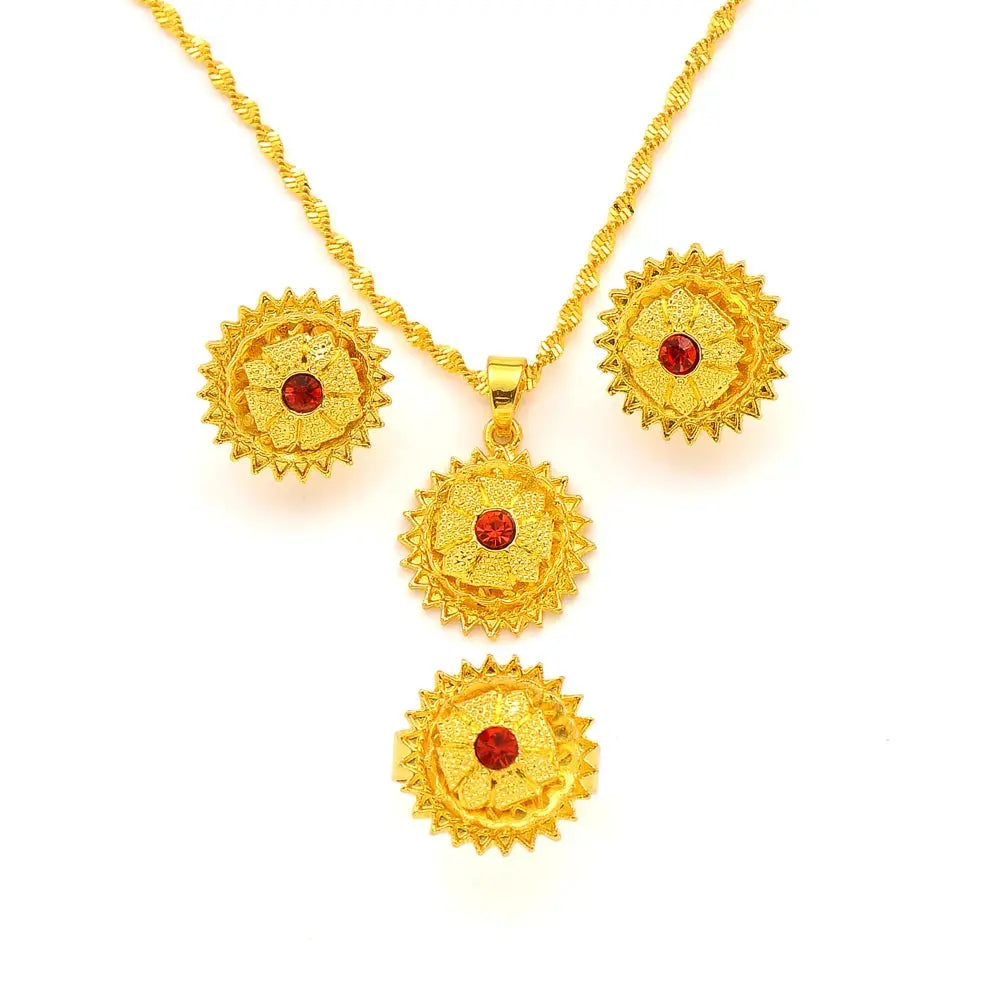 Gold color Ethiopian jewelry set including necklace, earrings, and ring, styled for a bride or festive occasion.