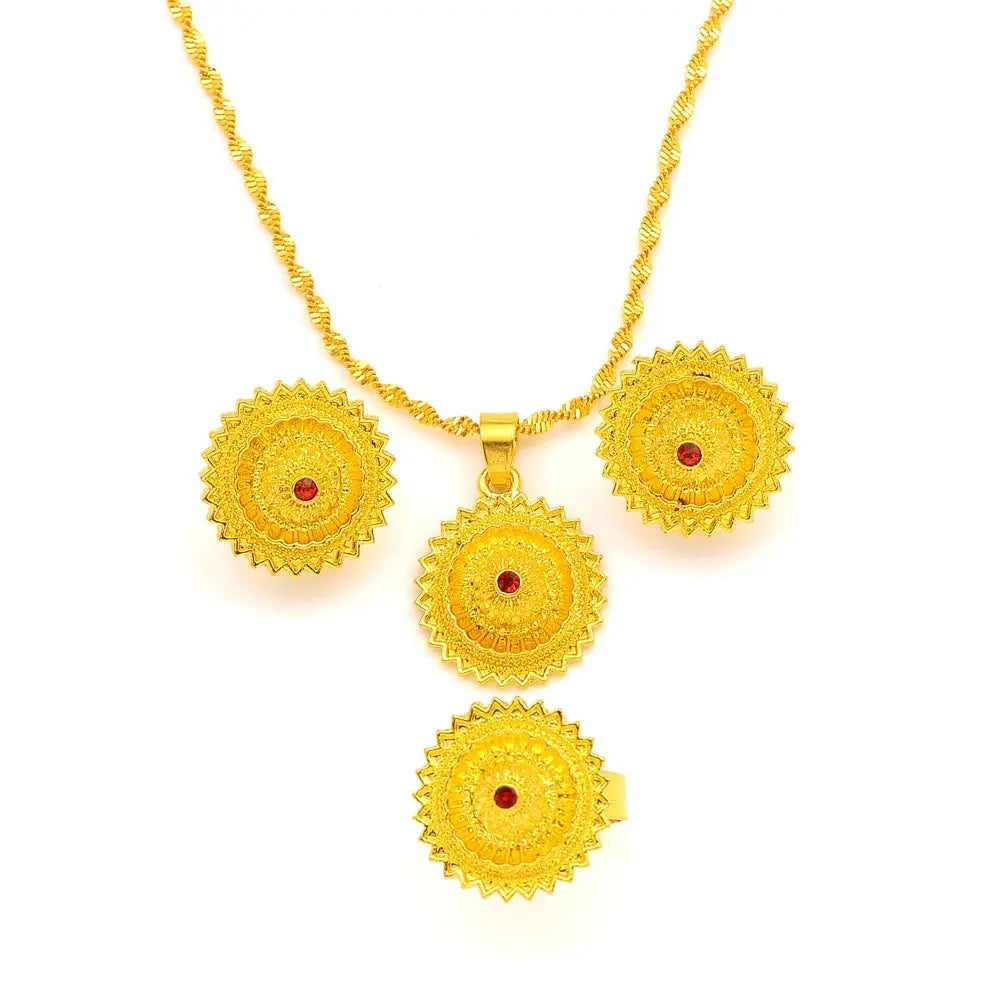 Gold color Ethiopian jewelry set including necklace, earrings, and ring, styled for a bride or festive occasion.