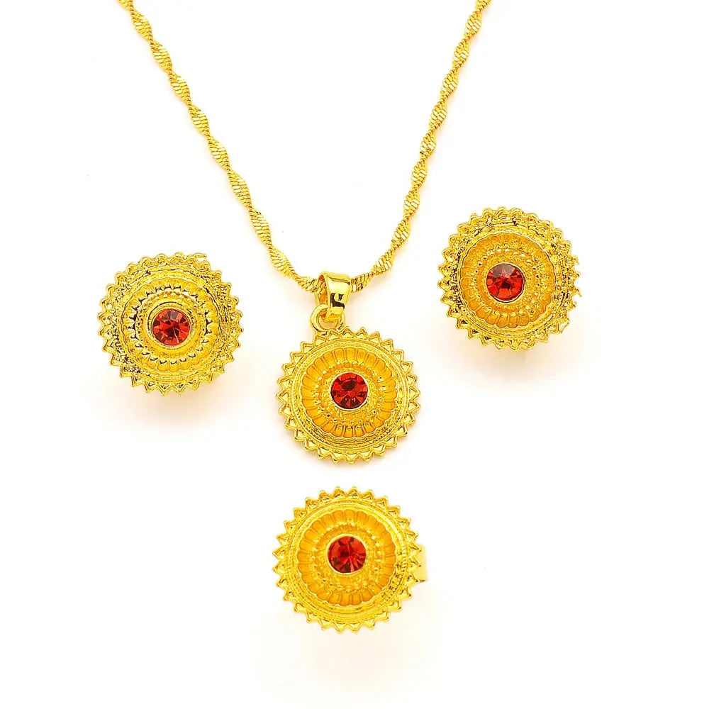 Gold color Ethiopian jewelry set including necklace, earrings, and ring, styled for a bride or festive occasion.