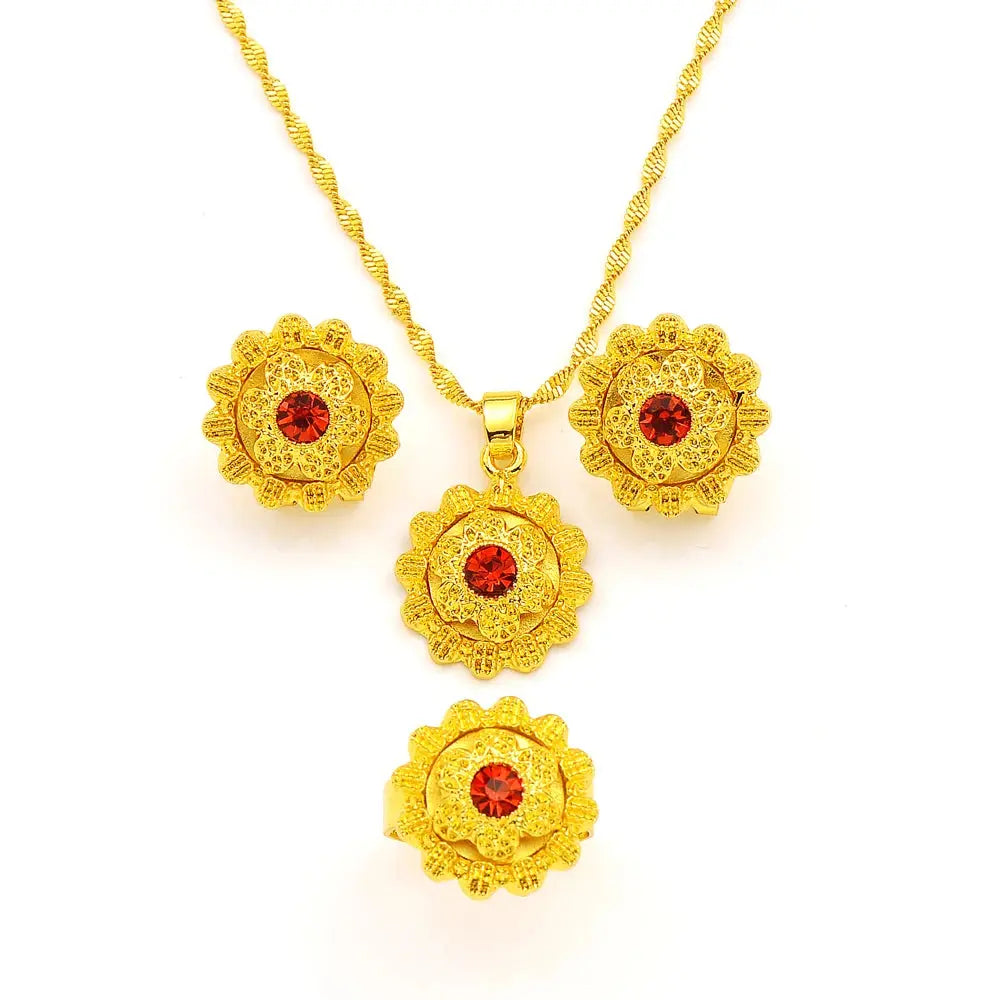 Gold color Ethiopian jewelry set including necklace, earrings, and ring, styled for a bride or festive occasion.