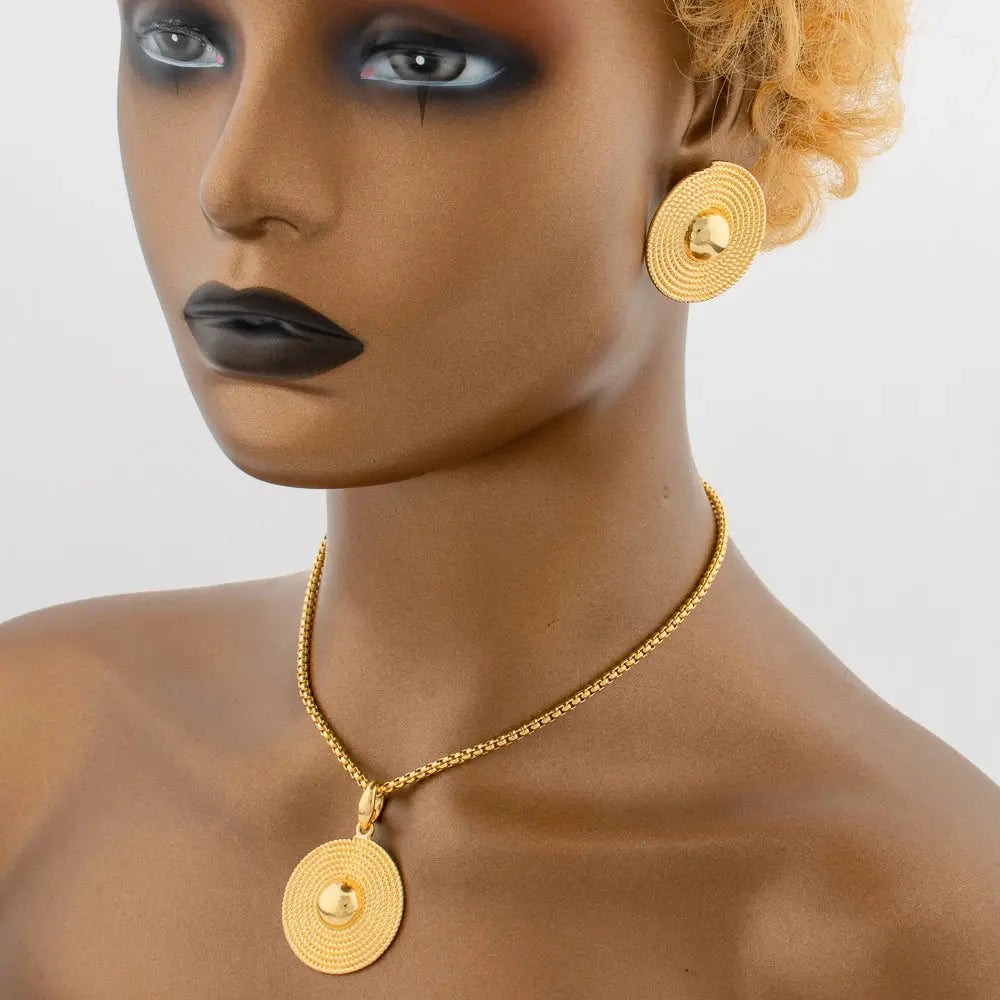 Gold-tone African-style jewelry set with necklace, earrings, bangle, and ring for weddings or parties.