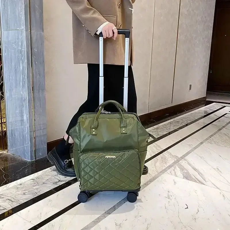 Stylish green portable travel bag with wheels being pulled in an elegant hotel setting.