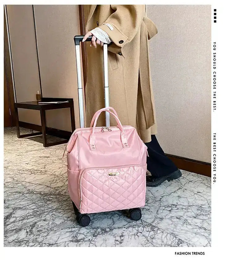 Stylish pink portable travel bag on wheels, designed for easy carrying and fashionable travel.