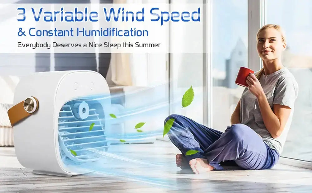 Person enjoying a portable air conditioner with variable wind speed and humidification while relaxing indoors.