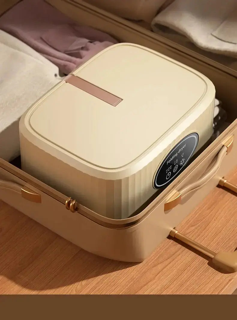 Sèche-linge électrique pliable NoEnName_Null dans une valise, prêt pour un séchage intelligent et portable.