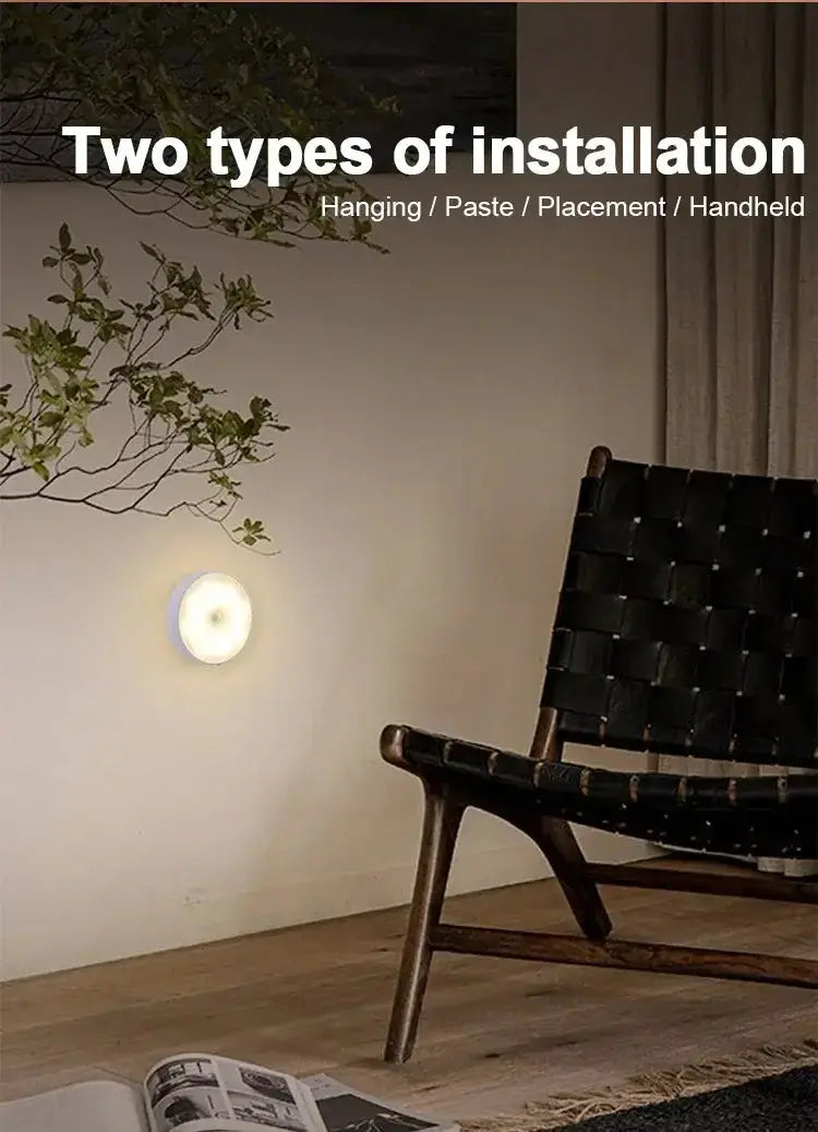 LED night light with two installation options: hanging and handheld, positioned next to a chair in a cozy room.