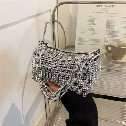 Silver rhinestone bucket bag with chain strap, stylish mini crossbody purse for women.