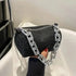 Black rhinestone bucket bag with silver chain, perfect for a glamorous evening or prom.