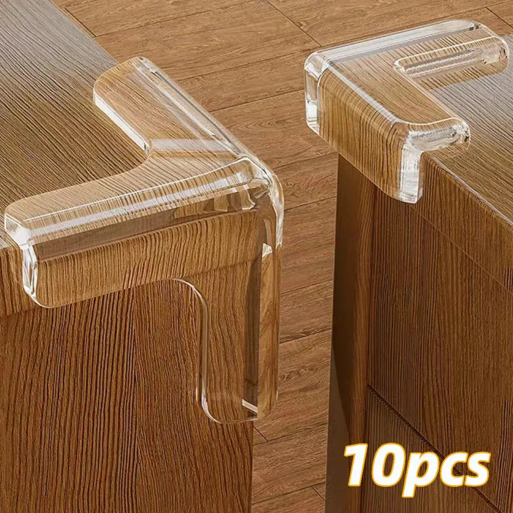 Transparent silicone baby safety corner guards on a wooden table to prevent child injury.


