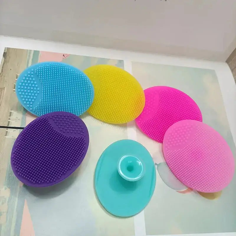 Set of silicone facial cleansing brushes for deep pore cleaning and exfoliation in various colors.