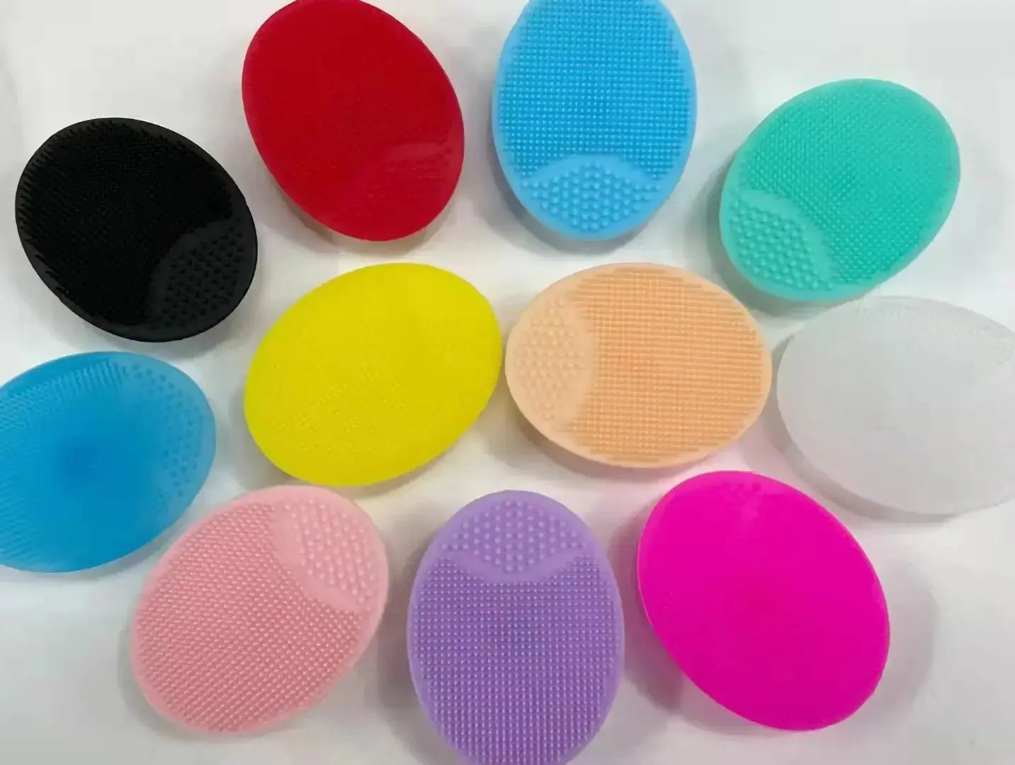Colorful silicone facial cleaning brushes for deep pore cleansing and exfoliation.
