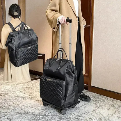 Stylish black portable travel bag on wheels, designed for women with a quilted pattern, ideal for carry-on luggage.