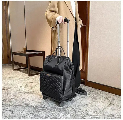 Stylish black portable travel bag on wheels, perfect for women, featured in modern indoor setting.